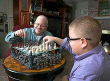Troy Fink enjoys a game of chess with his 12-year-old-son, Simon. (Photos courtesy of Richard Green)